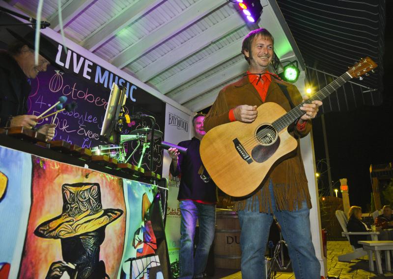 Guitarist James Davis is all smiles as Hot Sauce Band gets started on the Bluecoast patio. DENY HOWETH PHOTO